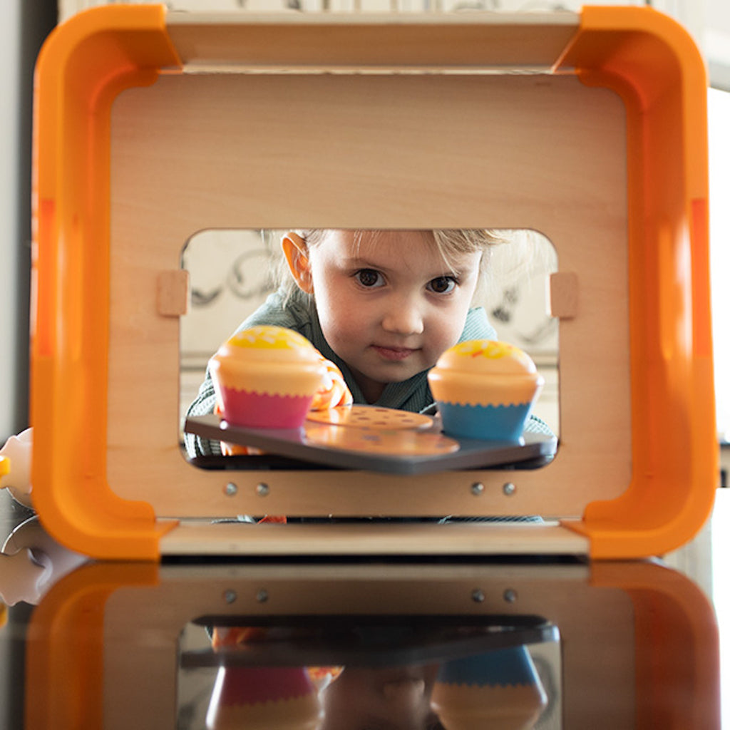 Child playing with Pretendables Bakery Set