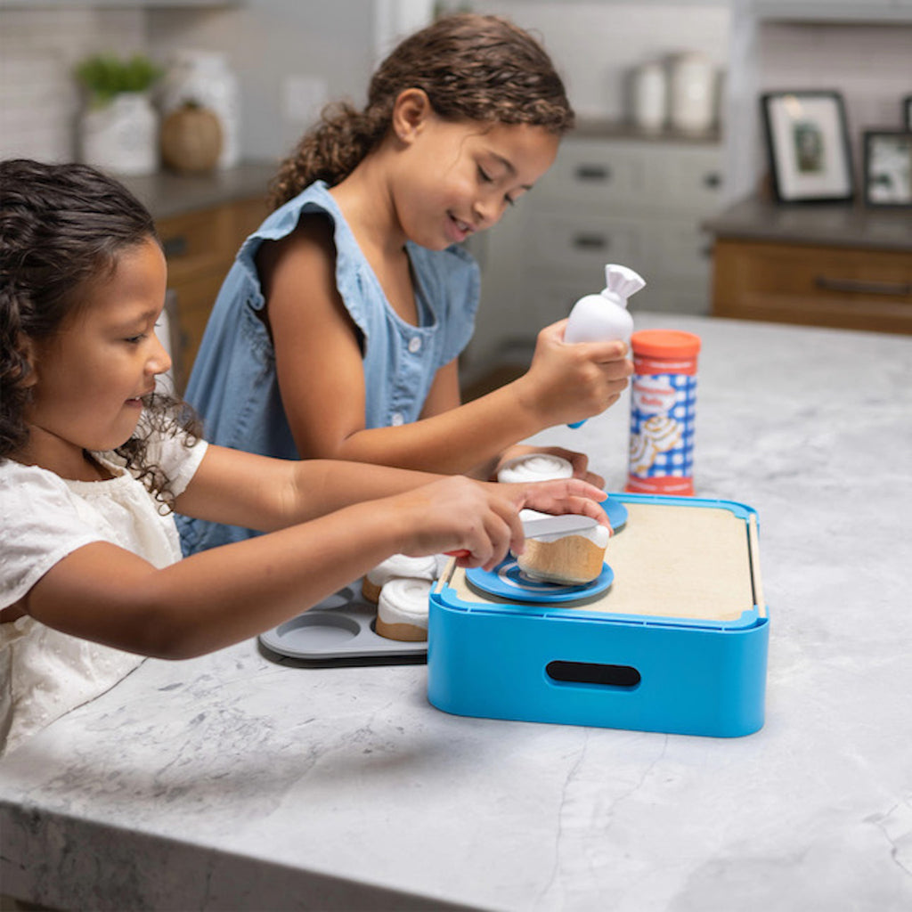 Children playing with Pretendables Cinnamon Roll Set