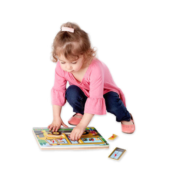 Girl In Pink Shirt Playing With Sound Puzzle
