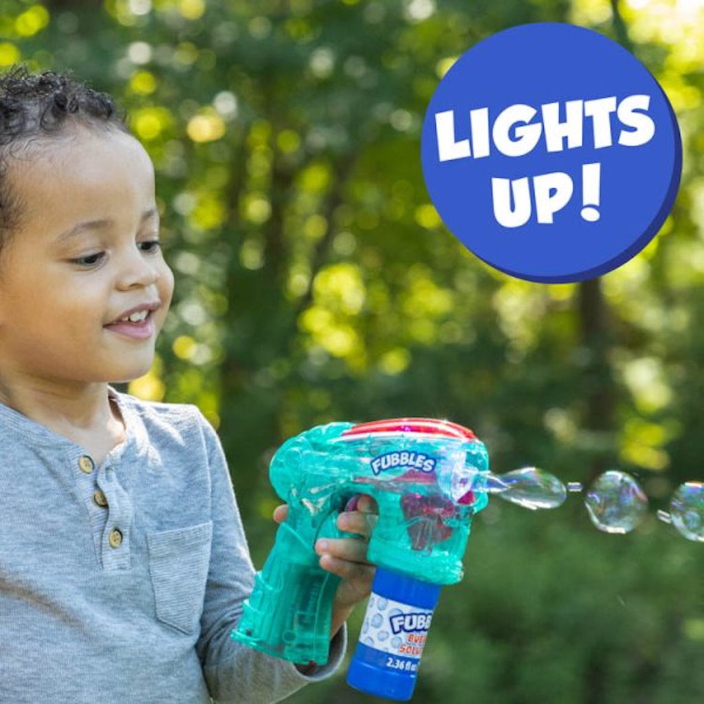 Child playing with Fubbles Light-Up Bubble Blaster