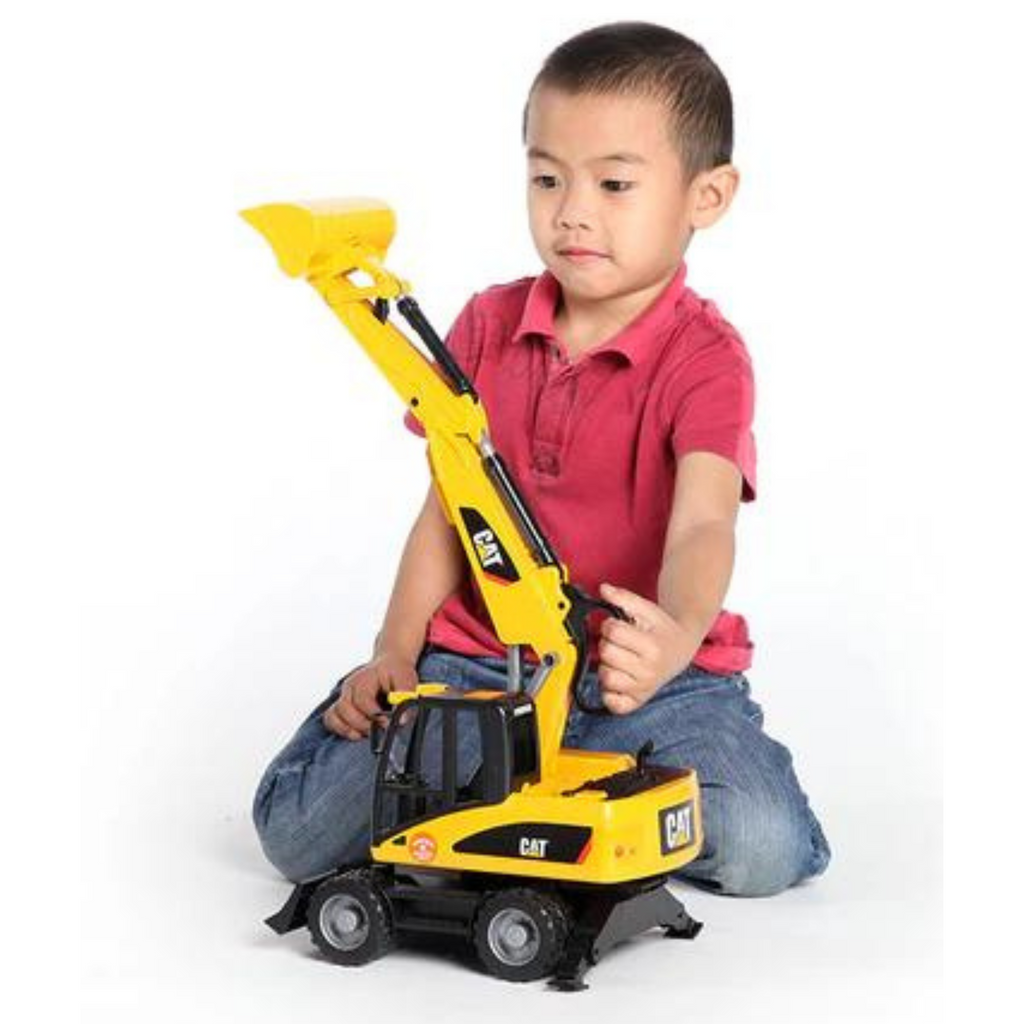 Child playing with CAT Small Wheel Excavator