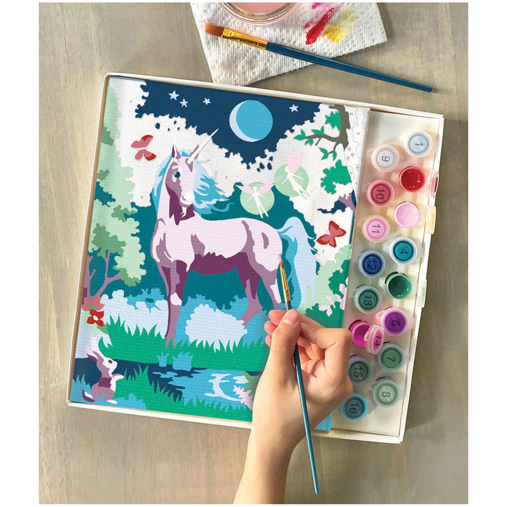 Child painting a Paint by Numbers Moonlit Unicorn Set