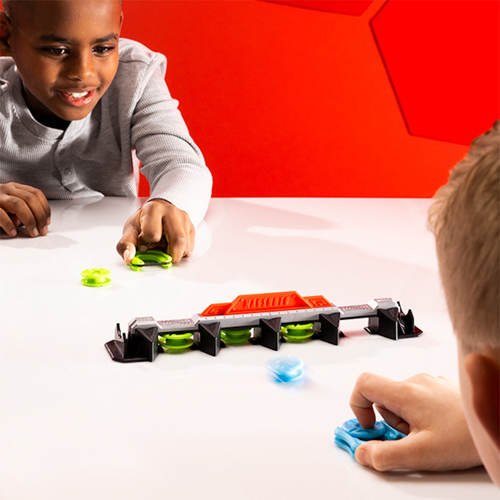 Two children playing with Magshuto Knockout Rail