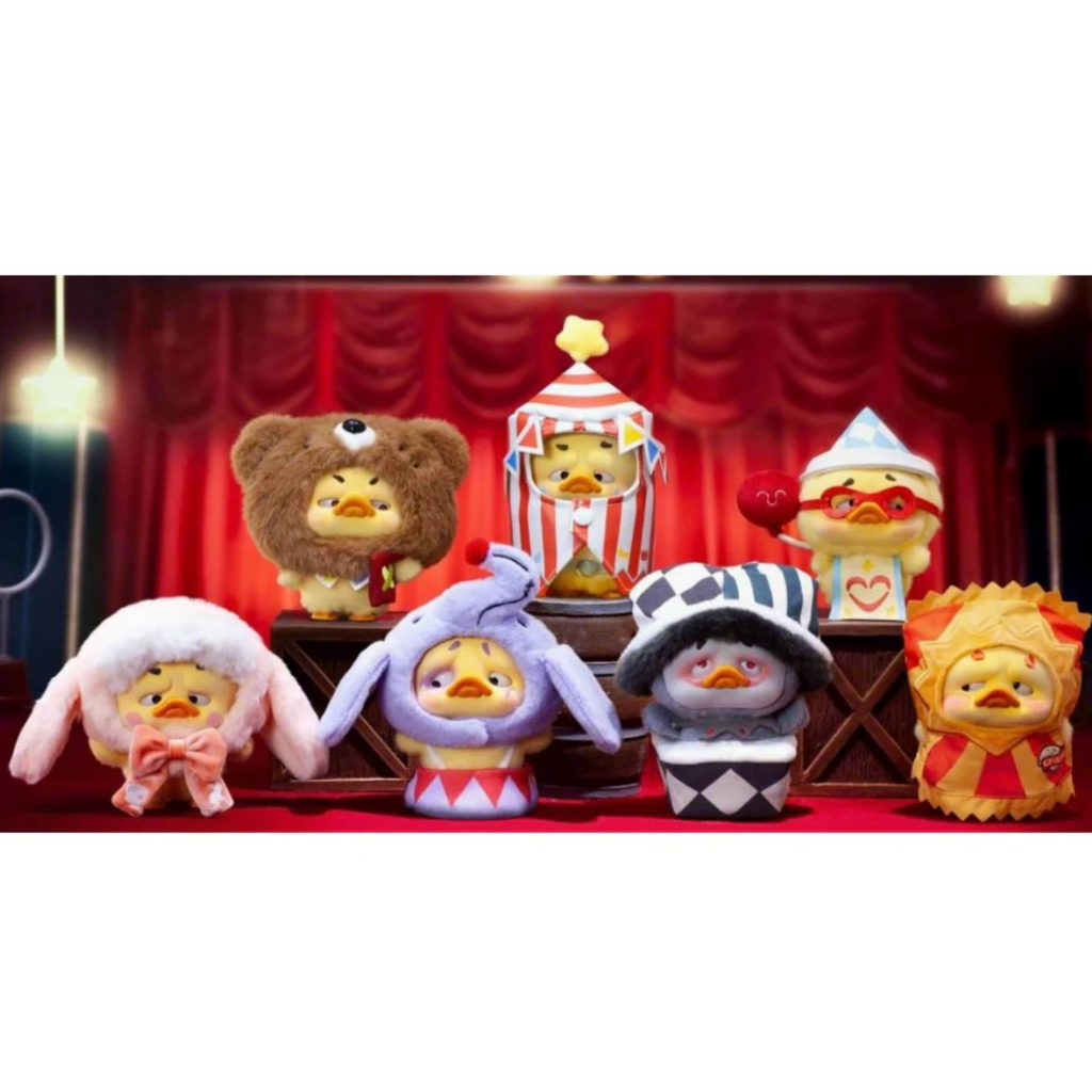 Collection of plush toys with costumes against a red curtain background