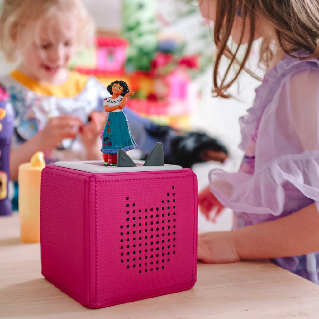 Disney Encanto Tonie on Pink Tonie Box with children in background