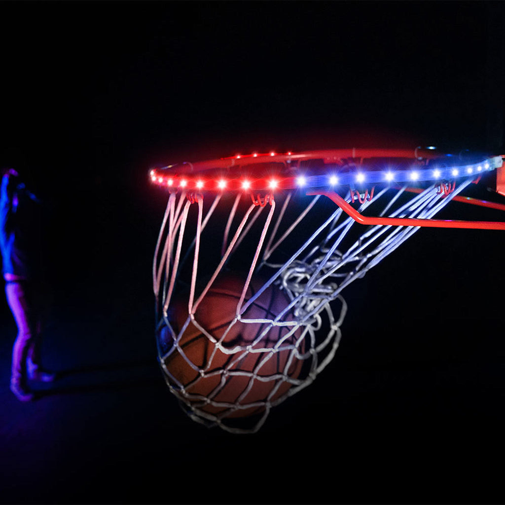 Basketball in hoop with rip lit up by HoopBrightz