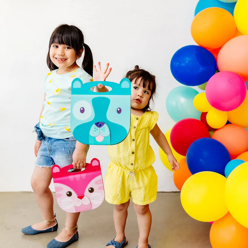 Two children holding Carry Along Sketchbook Dog and Cat