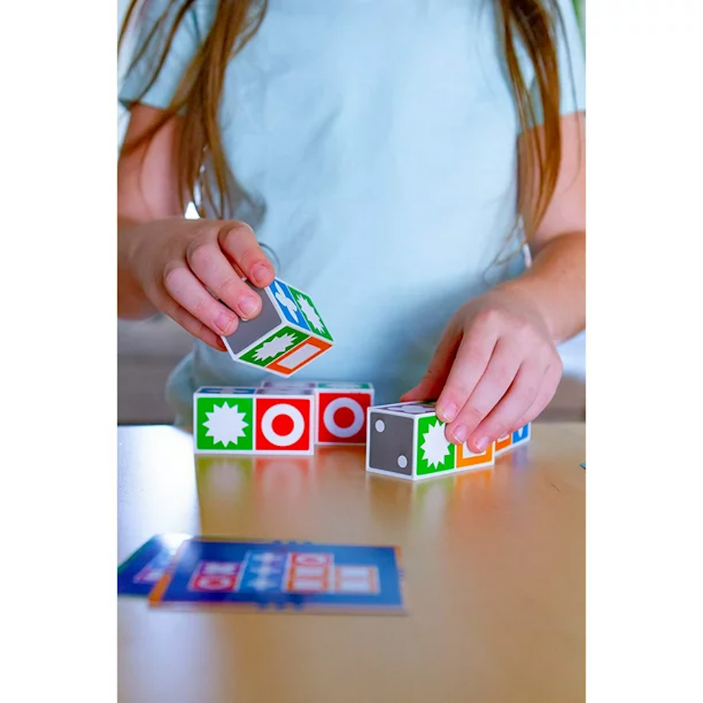 Girl playing with Match Madness at a table