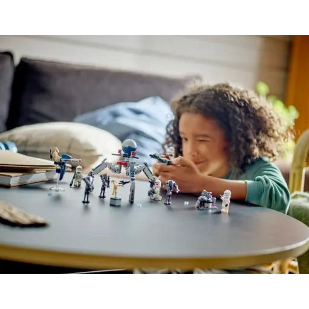 Child playing with Lego Star Wars Clone Trooper & Battle Droid Battle Pack Set