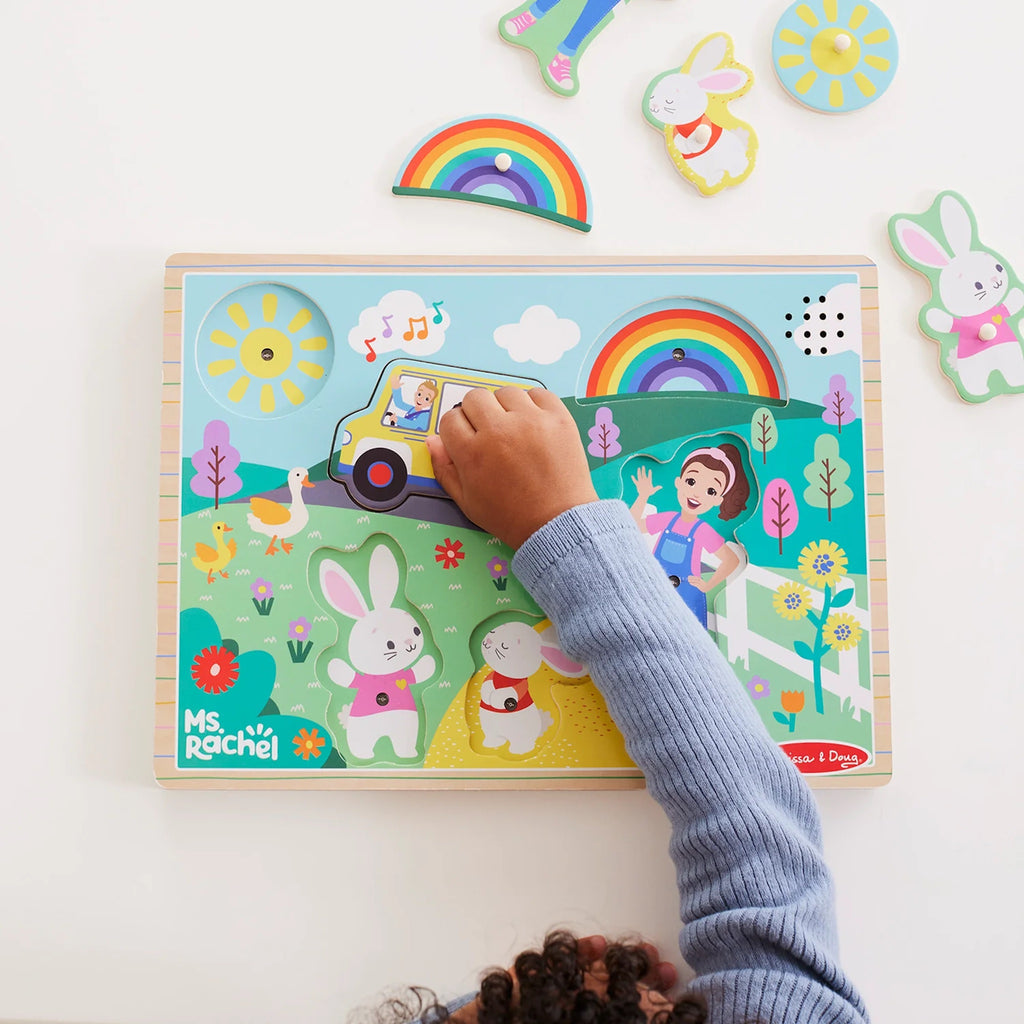 Child putting Ms. Rachel Sound Puzzle Piece into place