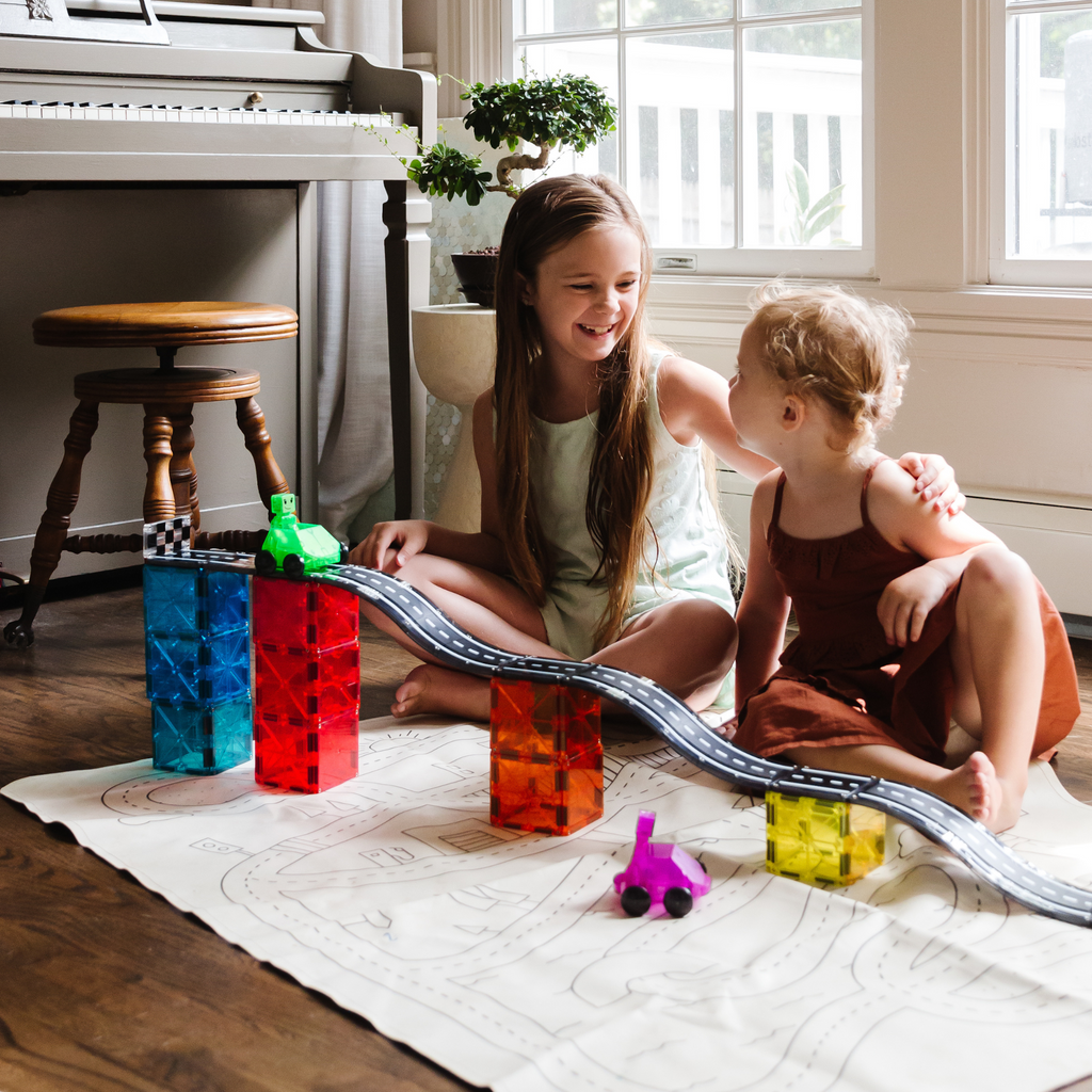 2 children playing with Magna-Tiles Downhill Duo