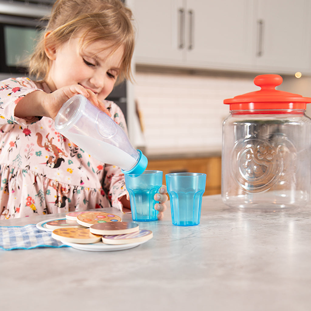 Child pretending to pour milk