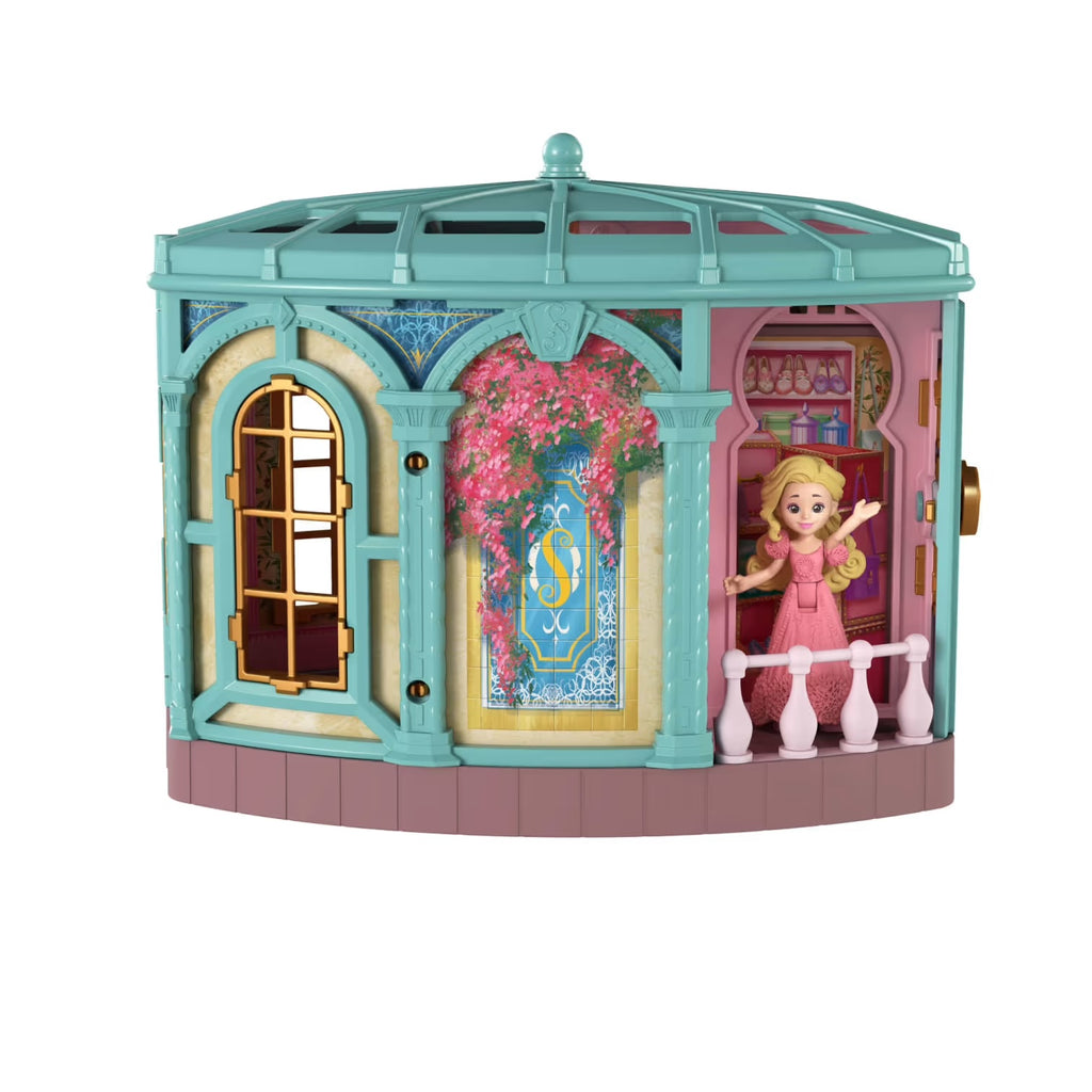 Wicked toy dollhouse with a doll in a pink dress on a white background