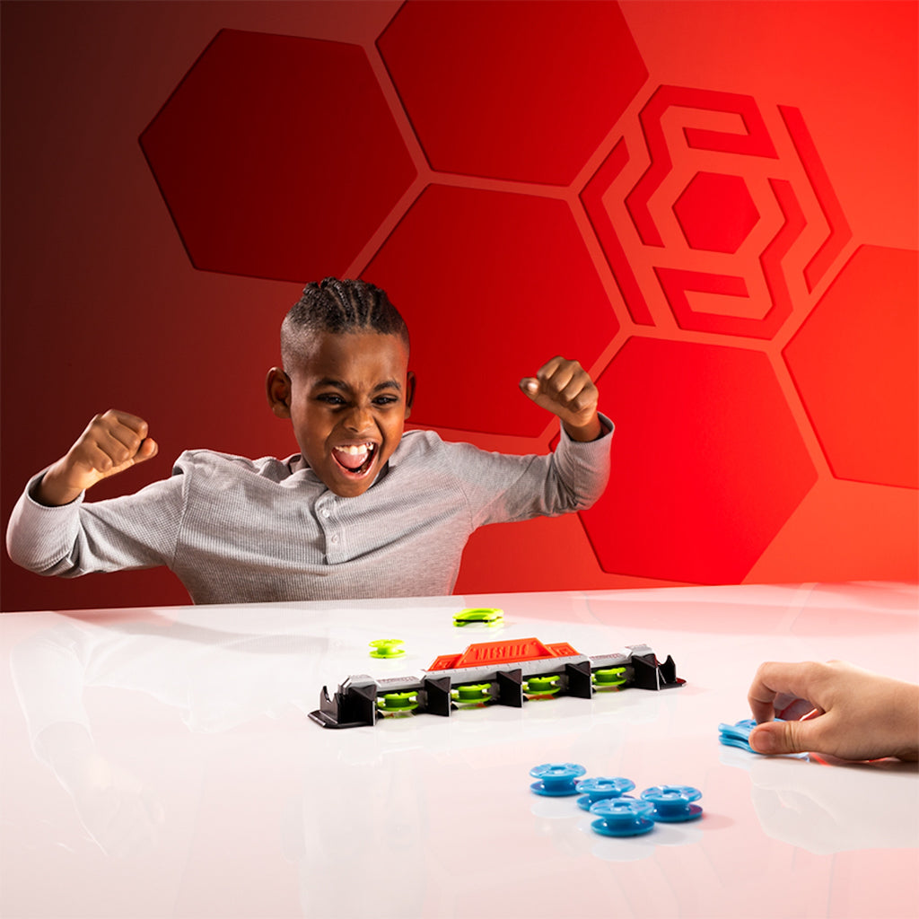 Child Excited Playing with Magshuto Knockout Rail