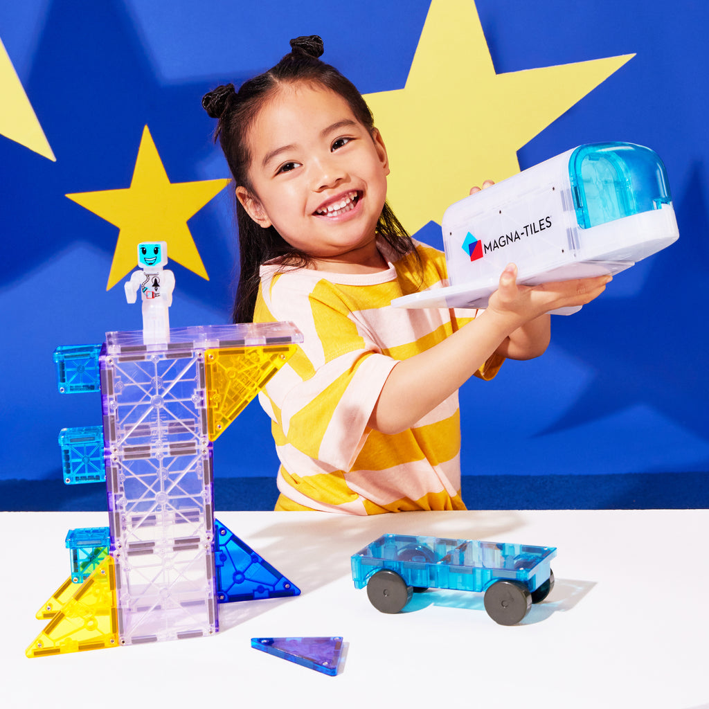 Child Playing with Magna-Tiles Space Set