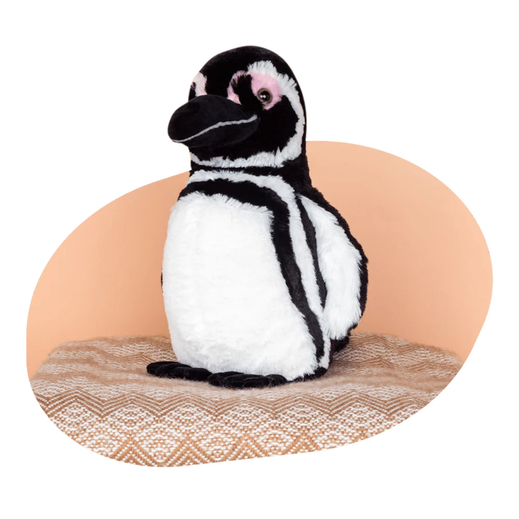 Passage Penguin Plush on a Patterned Mat