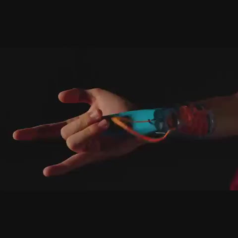 Video showing children using the web shooter ZipString Aracna against a black background and outdoors 