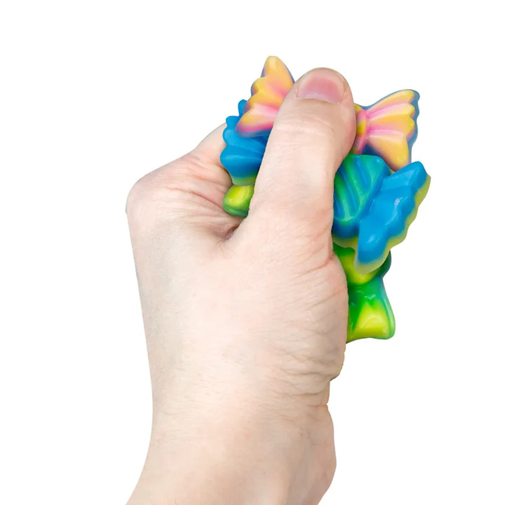Hand holding assorted colorful candy taba squishies