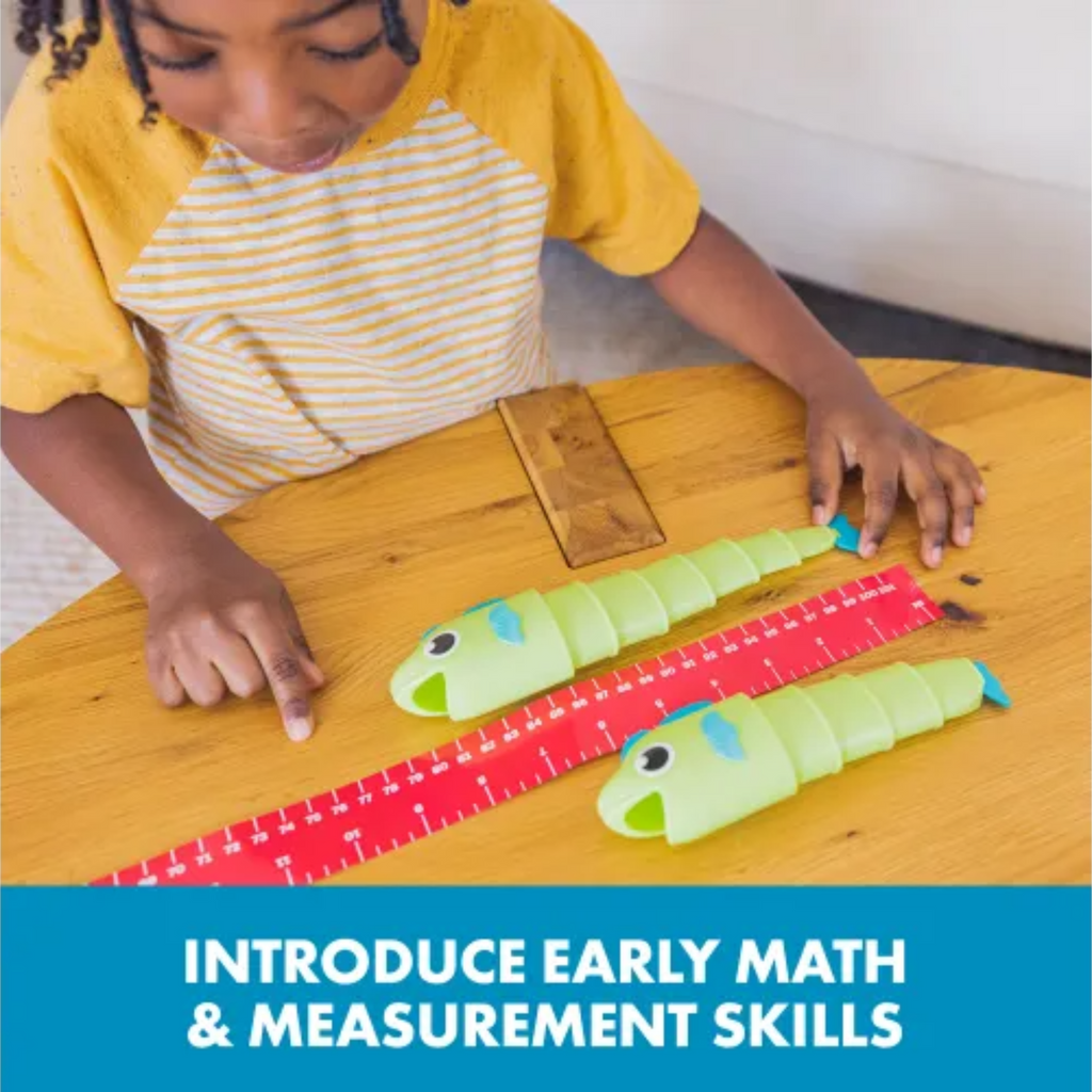 Child playing with educational tools on a wooden table, promoting early math and measurement skills.