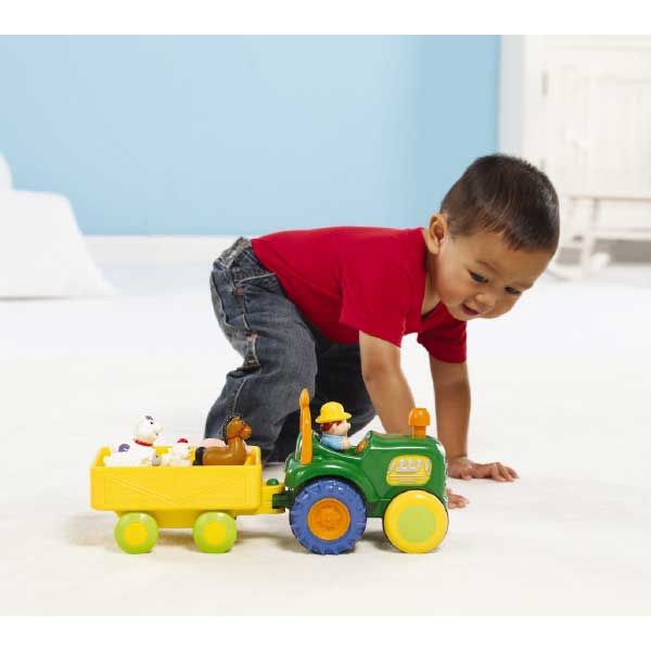 Little Boy Standing Up Playing with Funtime Tractor