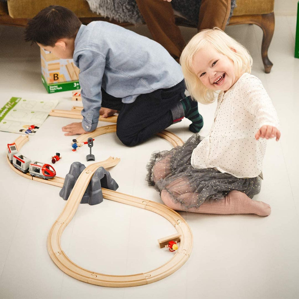 Kids Playing With Brio Railway Starter Set