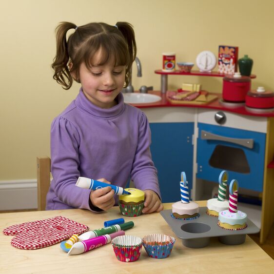 Child Playing with Cupcake Wooden Set